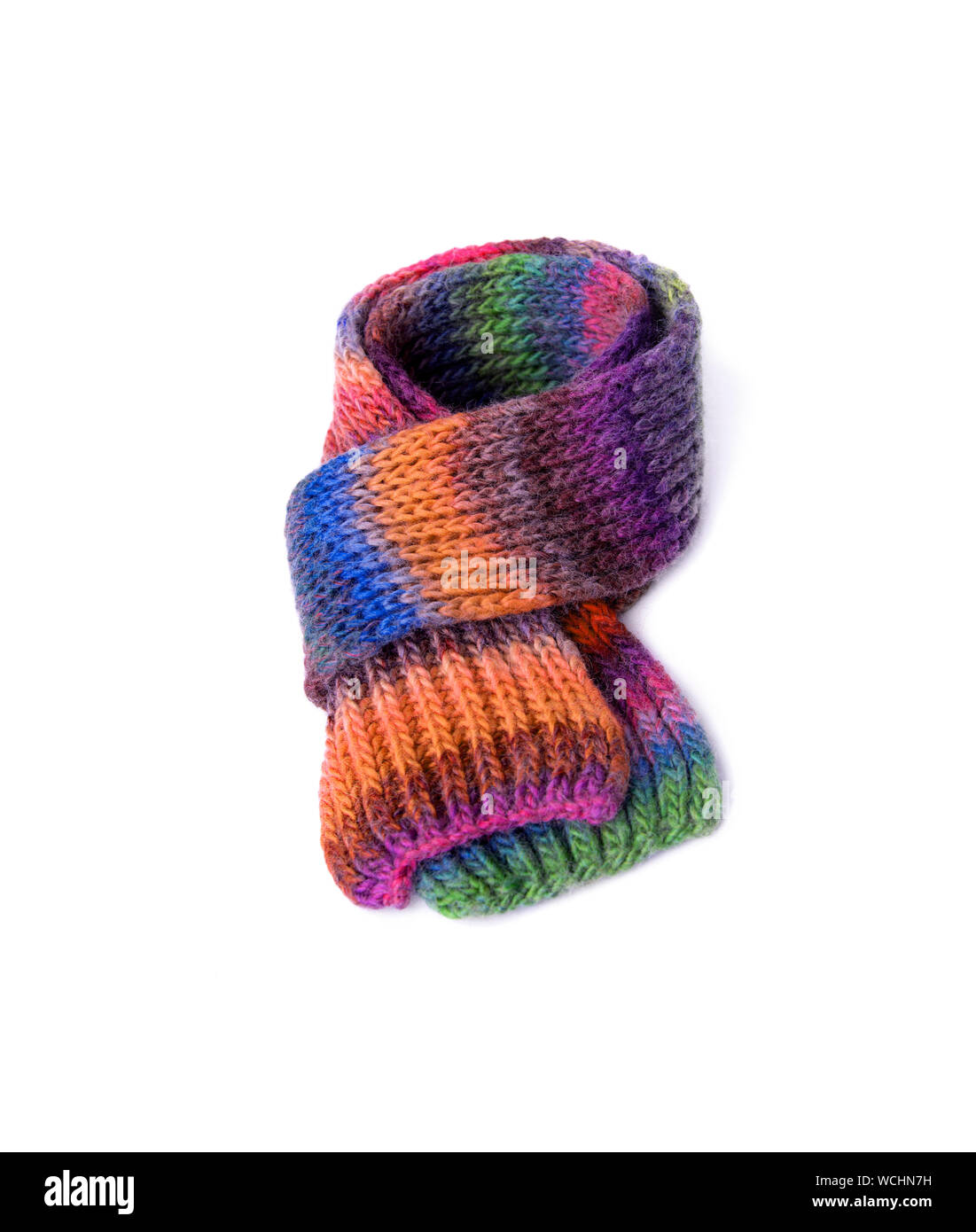 Winter multi-colored woolen scarf on white background. Stock Photo