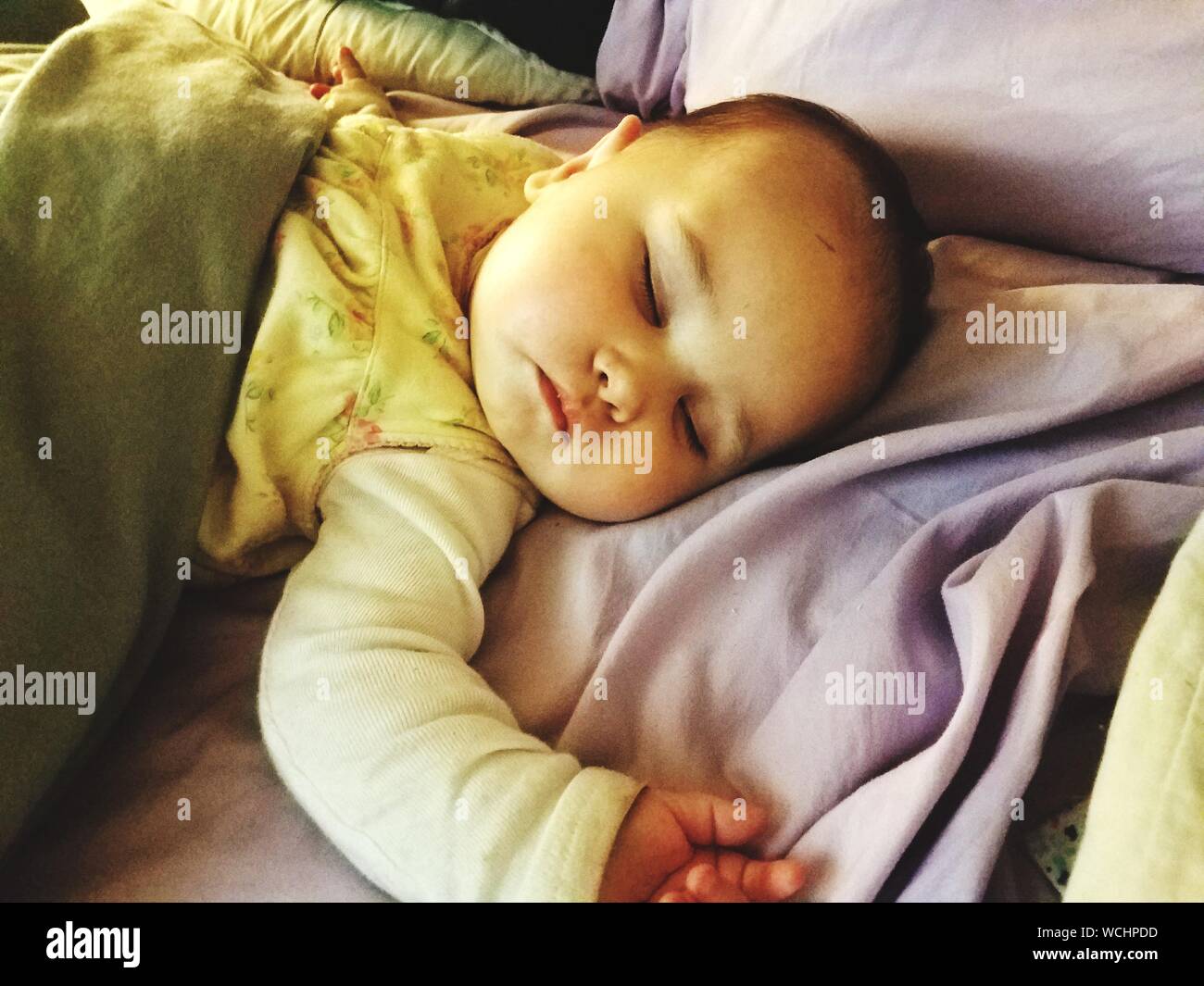 Baby Sleeping On Bed At Home Stock Photo Alamy