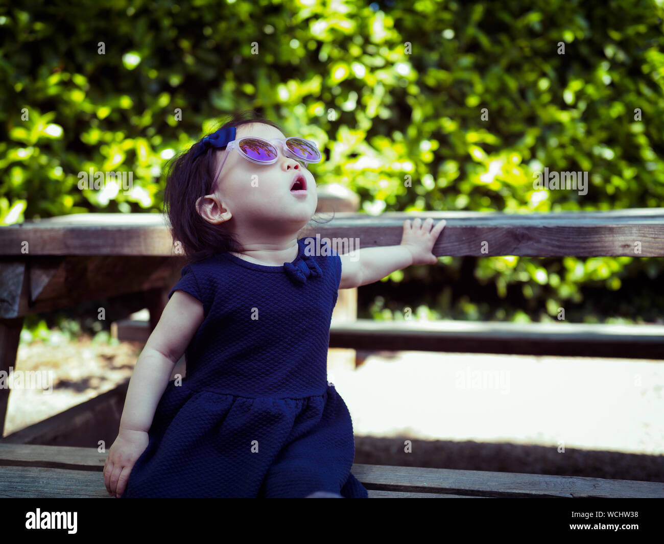 Indian girl sitting on bench hi-res stock photography and images - Alamy