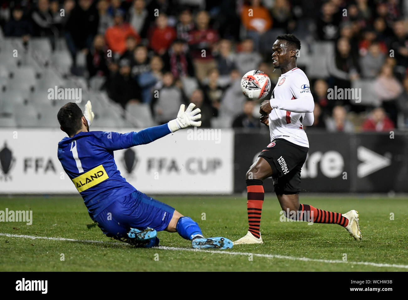 Campbelltown Stadium, Campbelltown, Australia. 28th Aug, 2019. FFA Cup round of 16, Sydney United 58 FC versus Western Sydney Wanderers FC ; Mohamed Adam of Western Sydney Wanderers chips the ball over Daniel Sadaka the advancing keeper - Editorial Use Only. Credit: Action Plus Sports/Alamy Live News Stock Photo