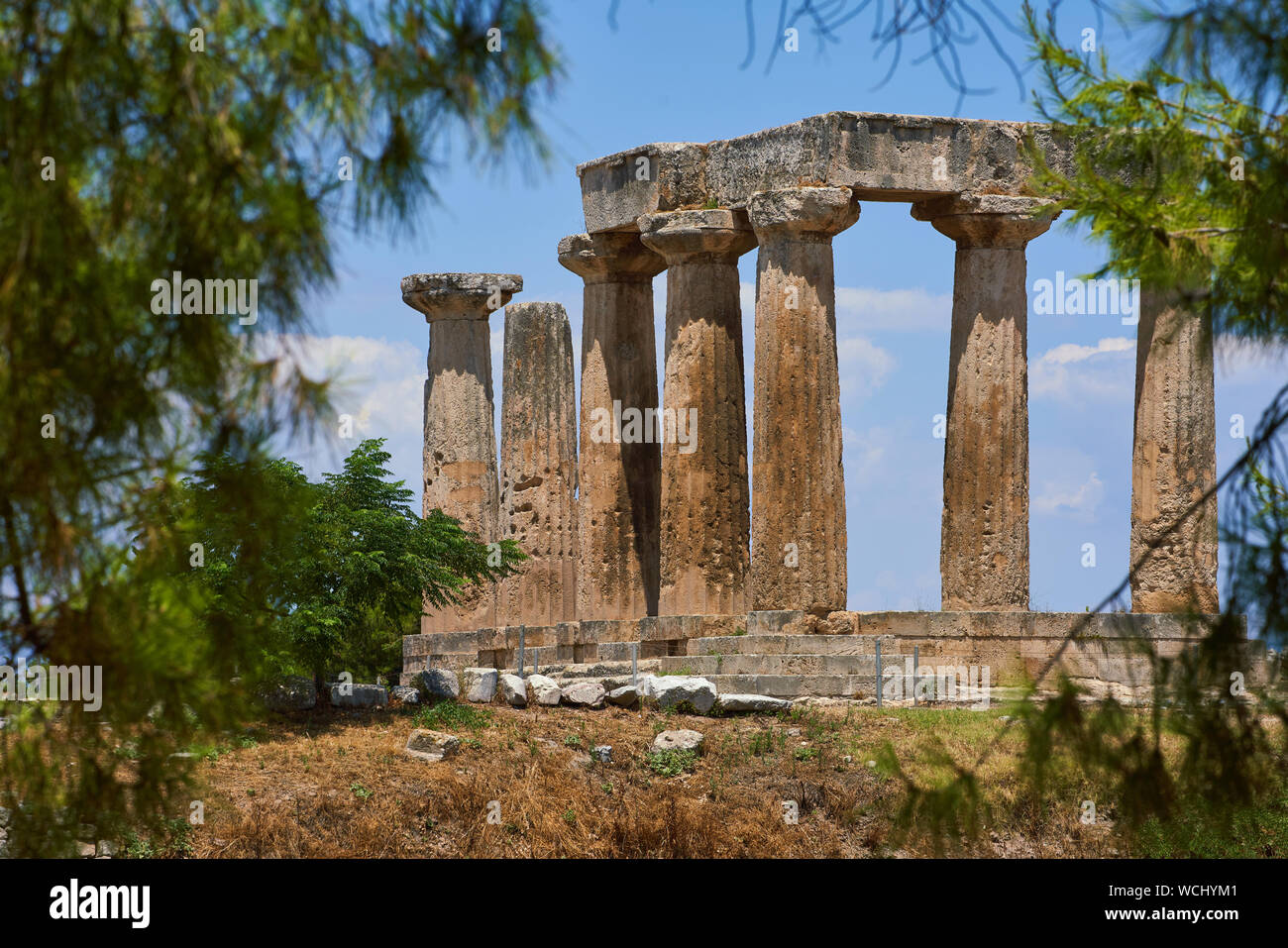 The ruins of the 5th century Doric Temple of Apollo in Ancient Corinth in Greece Stock Photo