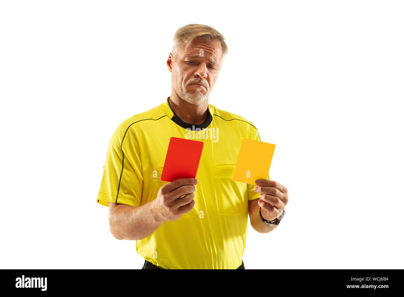 Referee showing a red and yellow cards to a football or soccer player
