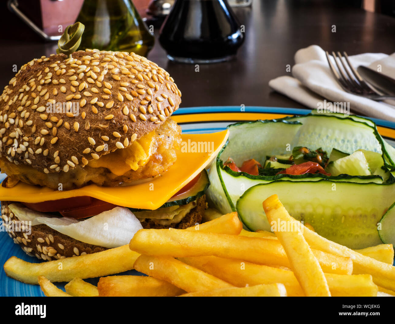 Close-up Of Cheeseburger With French Fries Served In Plate Stock Photo