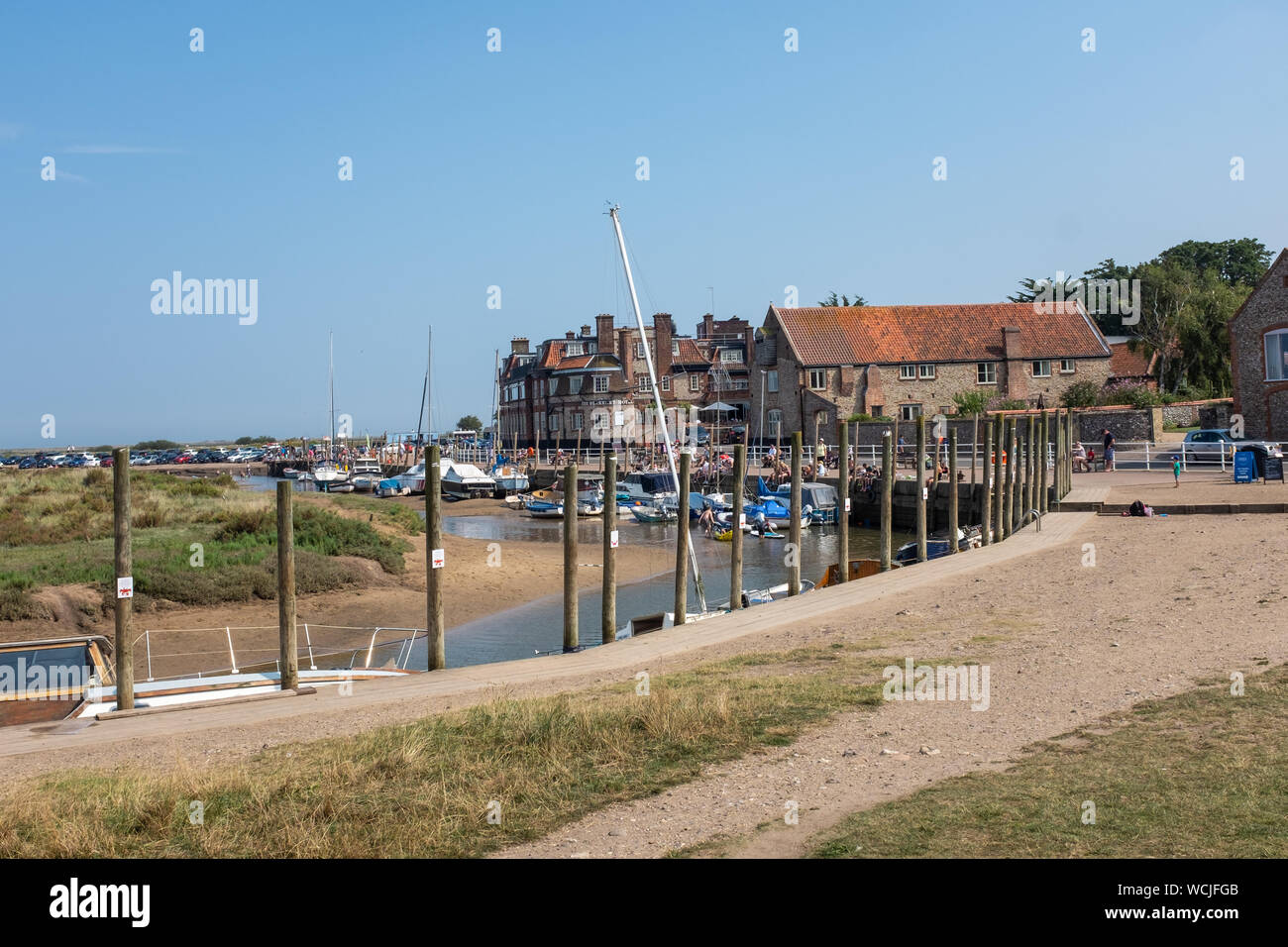 Norfolk coastal town of Blakeney, with River Glaven in foreground Stock Photo