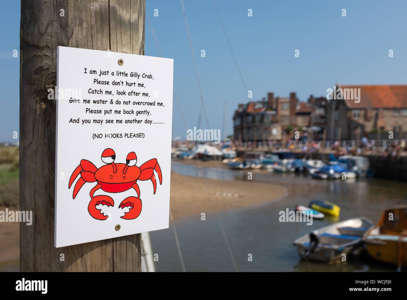 crabbing sign, nailed to wooden post in Blakeney, Norfolk, England, UK Stock Photo