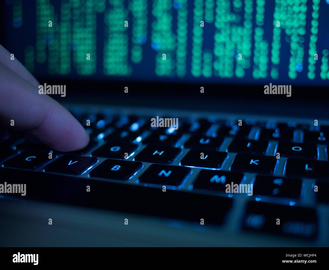 Cropped Hand Of Computer Hacker Typing On Keyboard Stock Photo - Alamy