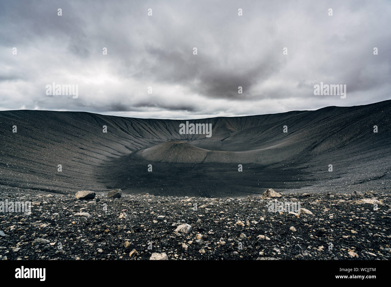 Scenic View Of Hverfjall Against Cloudy Sky Stock Photo