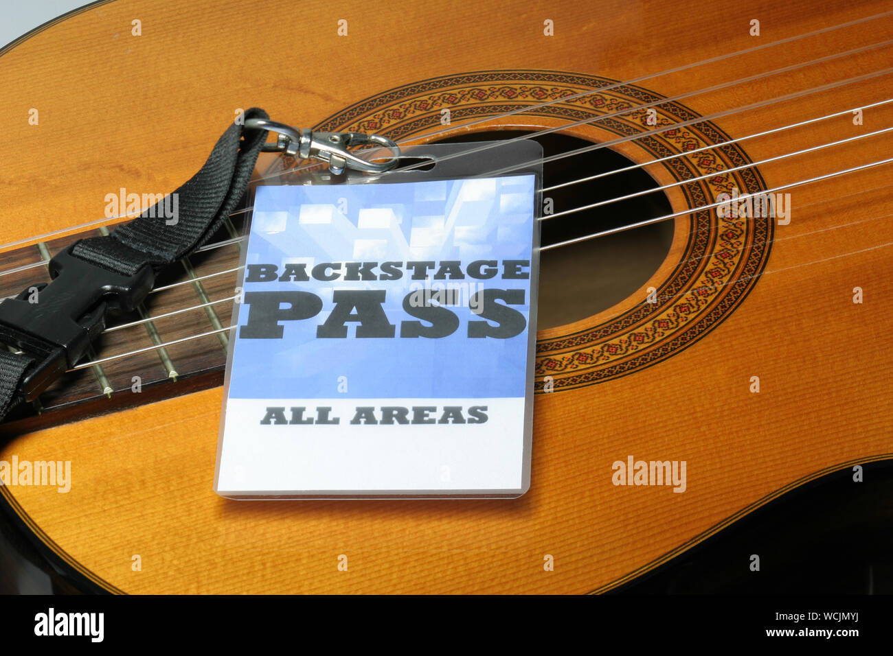 Close-up Of Acoustic Guitar With Id Card Stock Photo