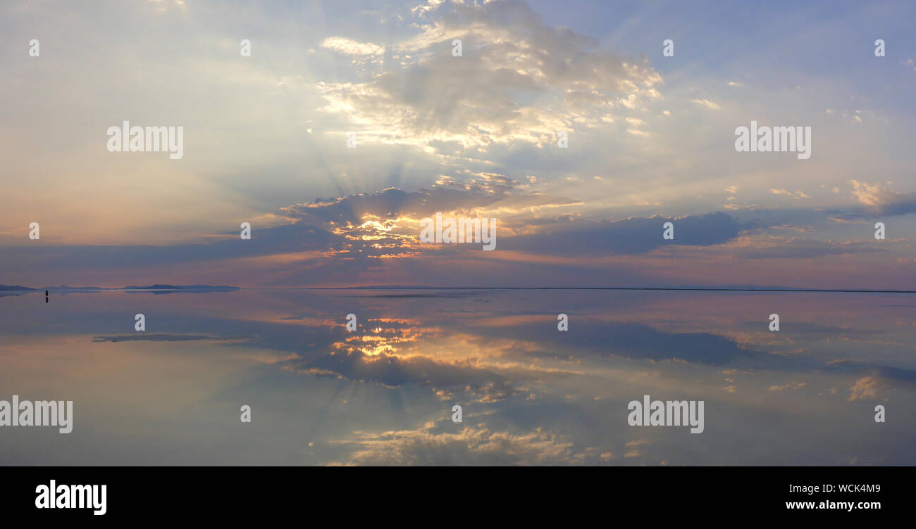 Panoramic View Of Lake At Bonneville Salt Flats Against Sky During Sunset Stock Photo