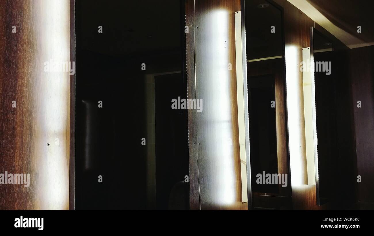 Mirrors On Wall Stock Photo - Alamy