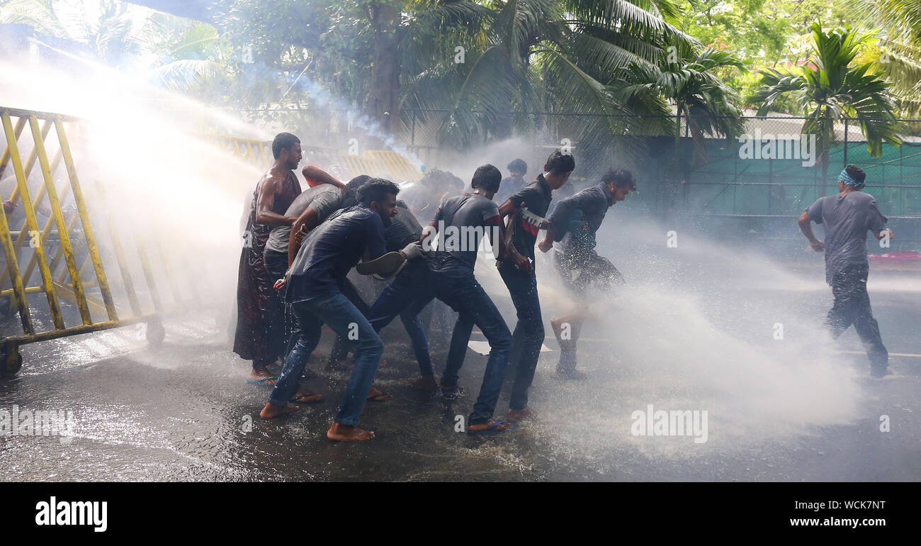 colombo-sri-lanka-28th-aug-2019-sri-lankan-university-students-run-for-cover-as-police-fire-tear-gas-and-use-water-cannon-to-disperse-demonstrators-during-a-protest-in-colombo-photo-by-krishan-kariyawasampacific-press-credit-pacific-press-agencyalamy-live-news-WCK7NT.jpg