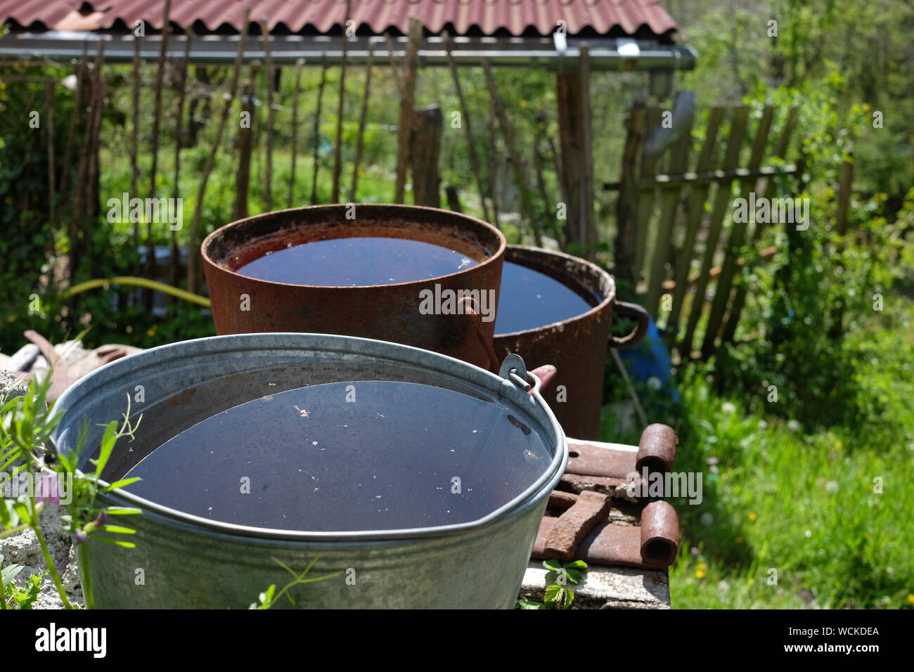 Buckets Full Of Water Stock Photo - Alamy