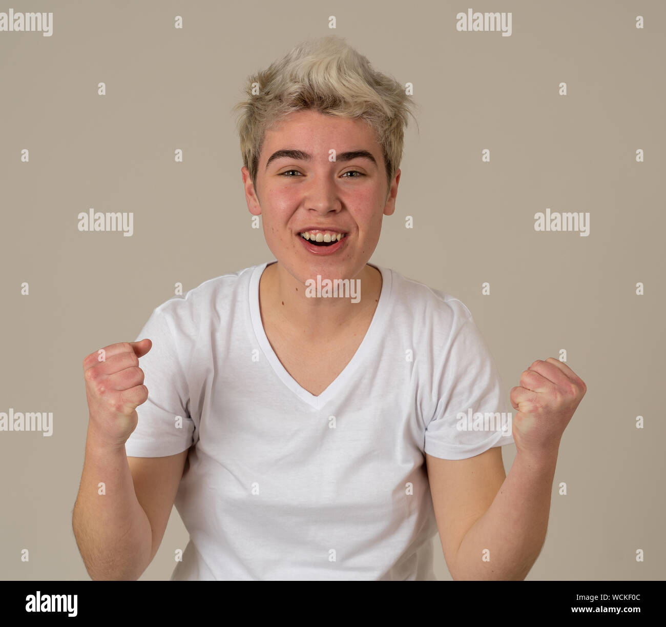 Portrait of young happy and excited transgender teen happy and excited winning, celebrating goal or having great success with proud face. In People Di Stock Photo