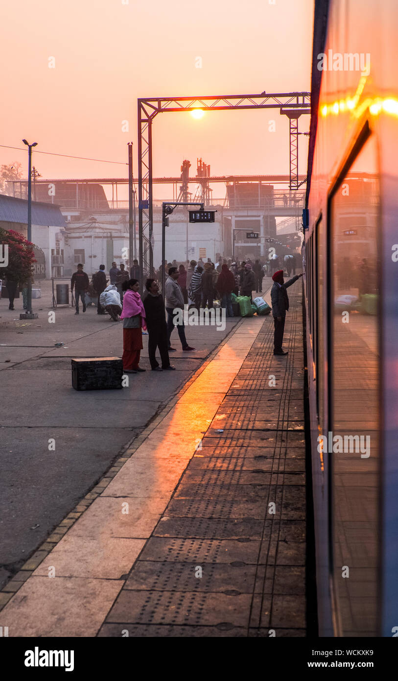 Passengers boarding a train in early morning ,India Stock Photo