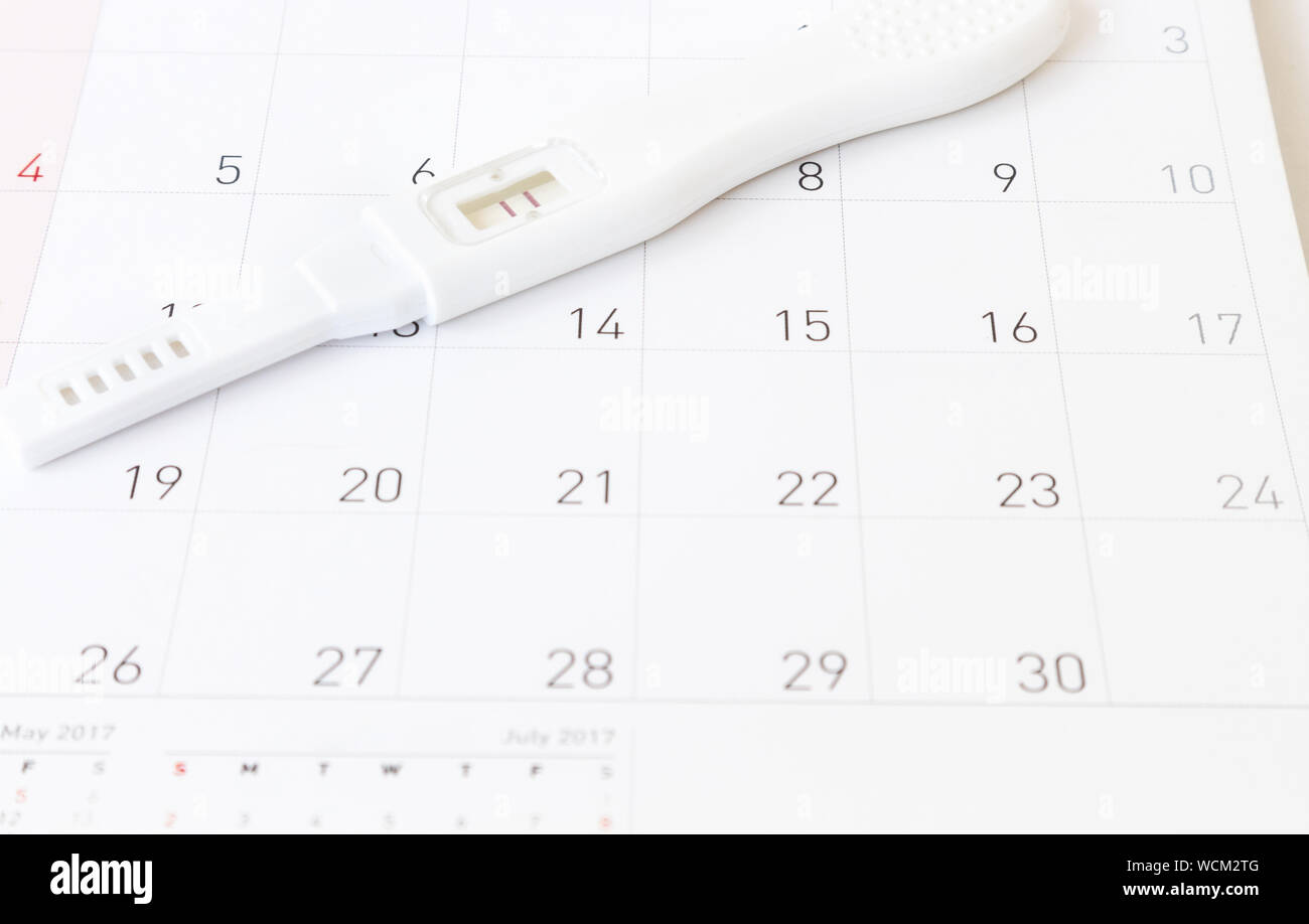 Close-up Of Pregnancy Test On Calendar Stock Photo