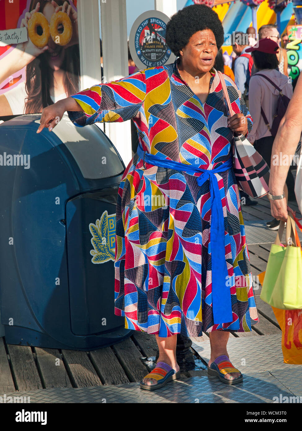 A colourful dress worn by a day-tripper to Brighton Stock Photo