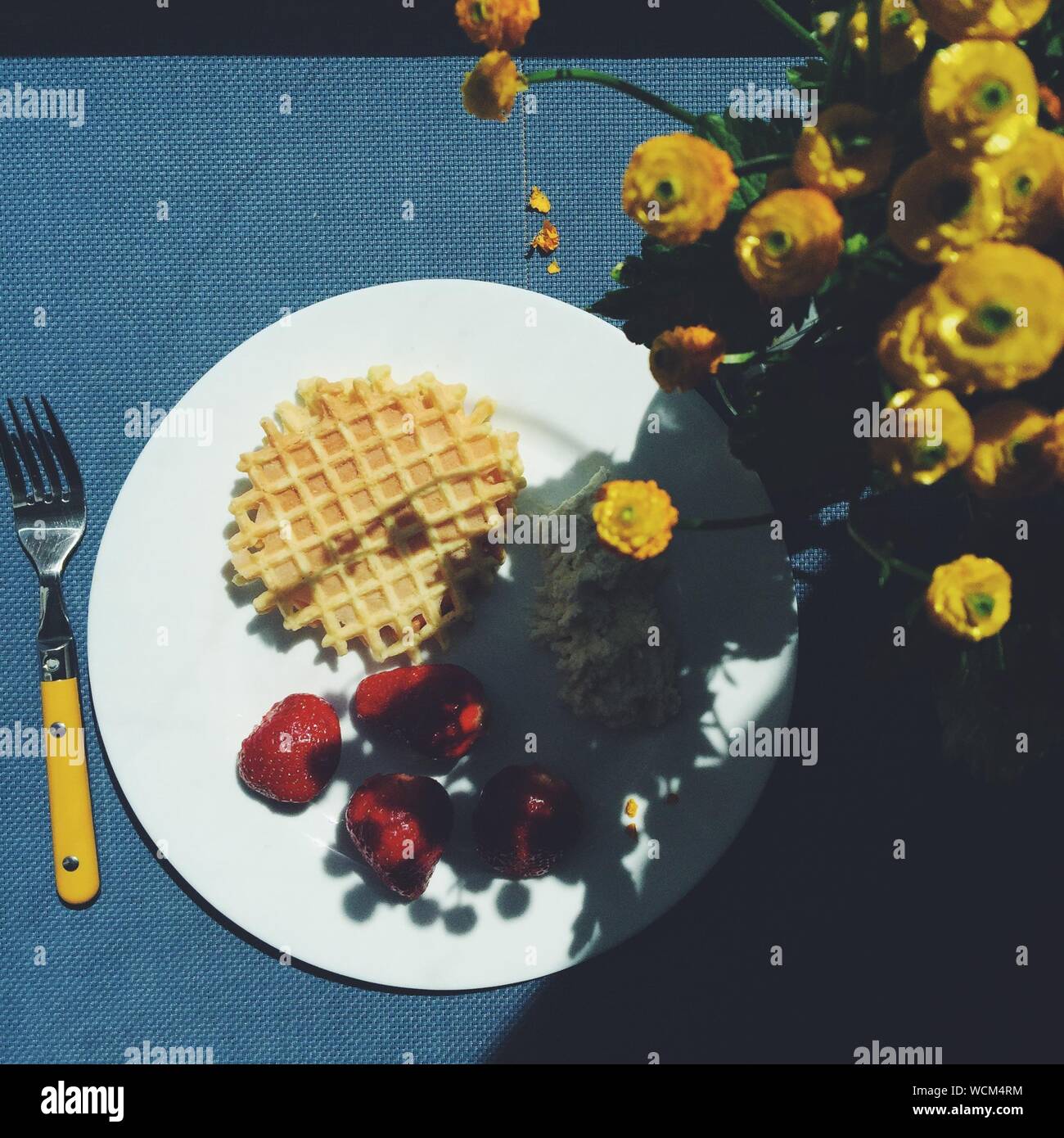 Directly Above Shot Of Strawberries With Waffles And Cottage