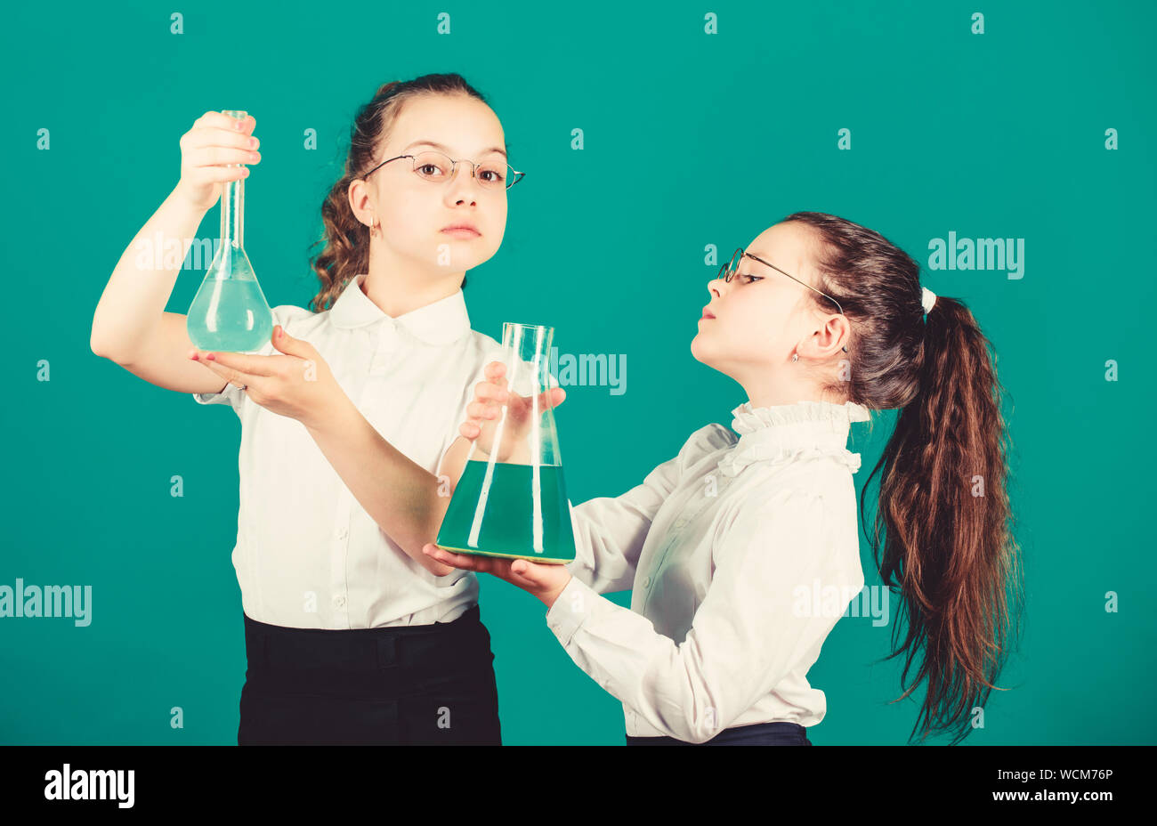 children study chemistry lab. back to school. biology education. little smart girls with testing flask. school kid scientist studying science. Bright minds at work. laboratory work. school work place. Stock Photo