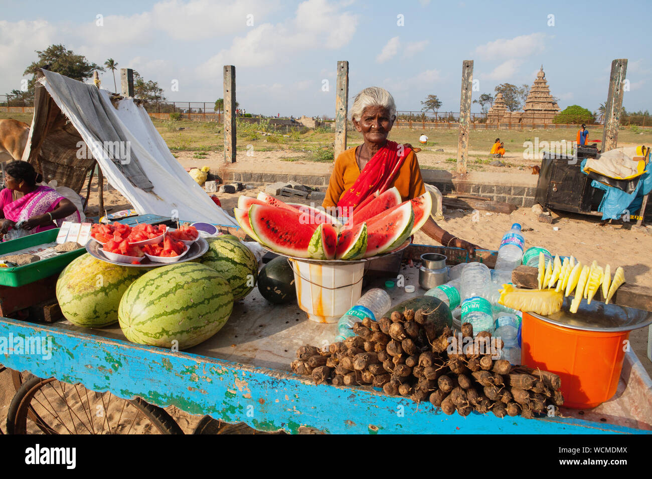 India, Tamil Nadu, Mahabalipuram, Watermelon & pineapple vendor in front of the Shore Temple in