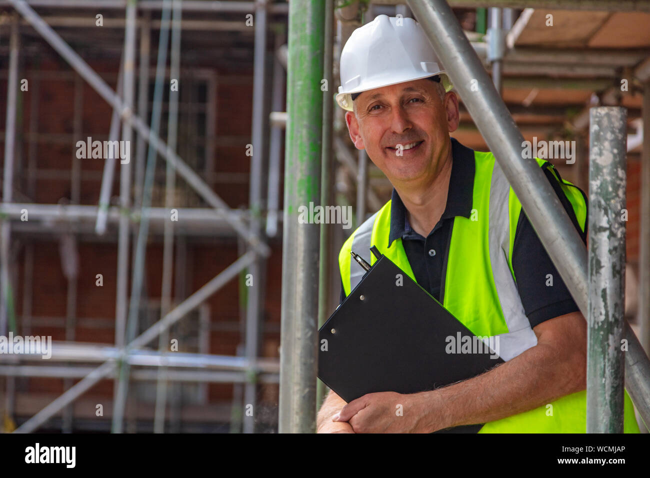 Male builder foreman, construction worker, surveyor or site manager