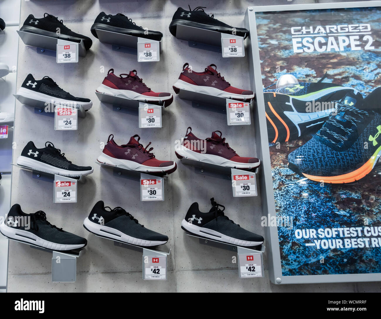 Under Armour trainers/training shoes store display in Sports Direct store.  UK Stock Photo - Alamy