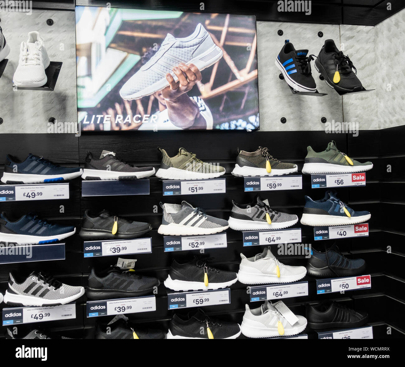 Adidas trainers/training shoes store display in Sports Direct store. UK  Stock Photo - Alamy