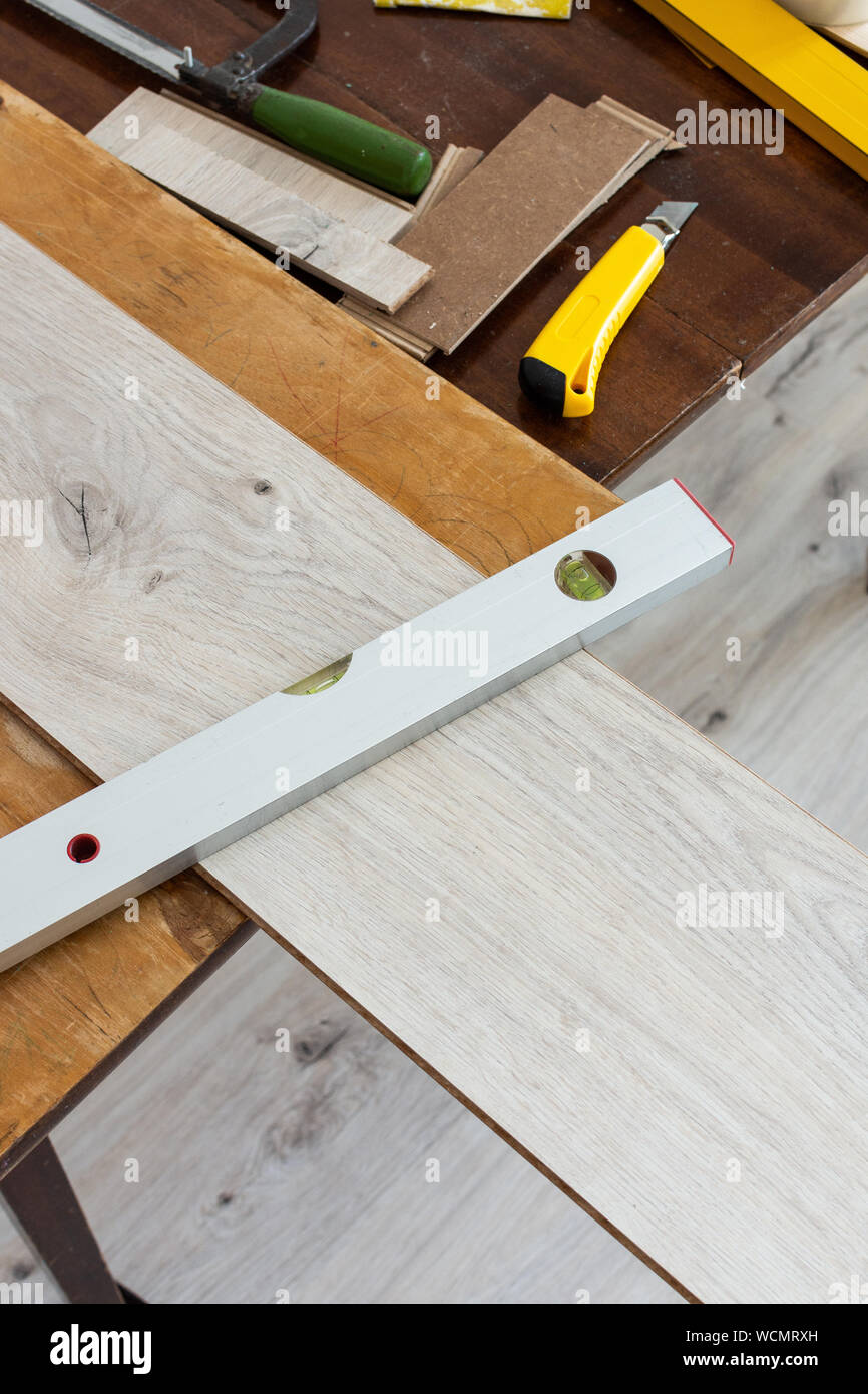 Installation Laminate Or Parquet In The Room Worker Installing