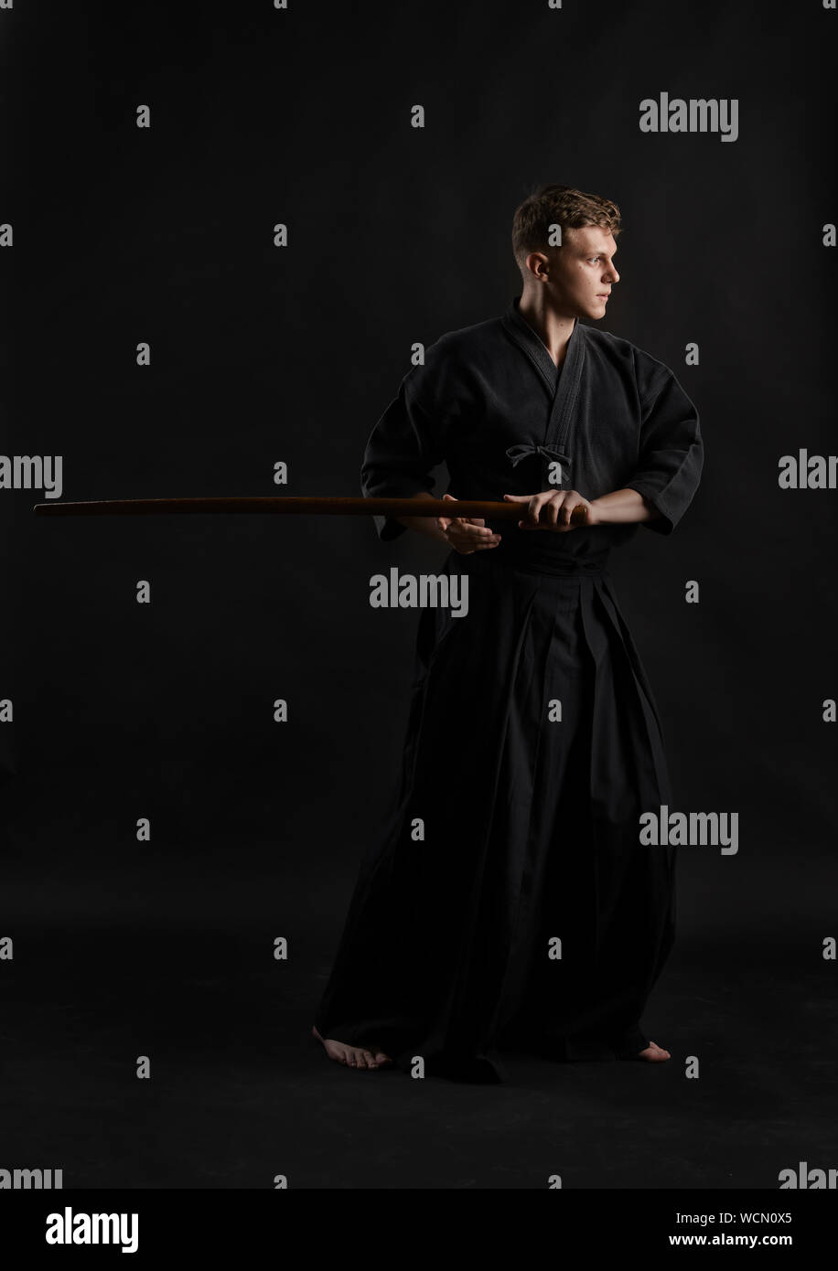 Concentrated Kendo fighter wearing in a traditional japanese kimono is