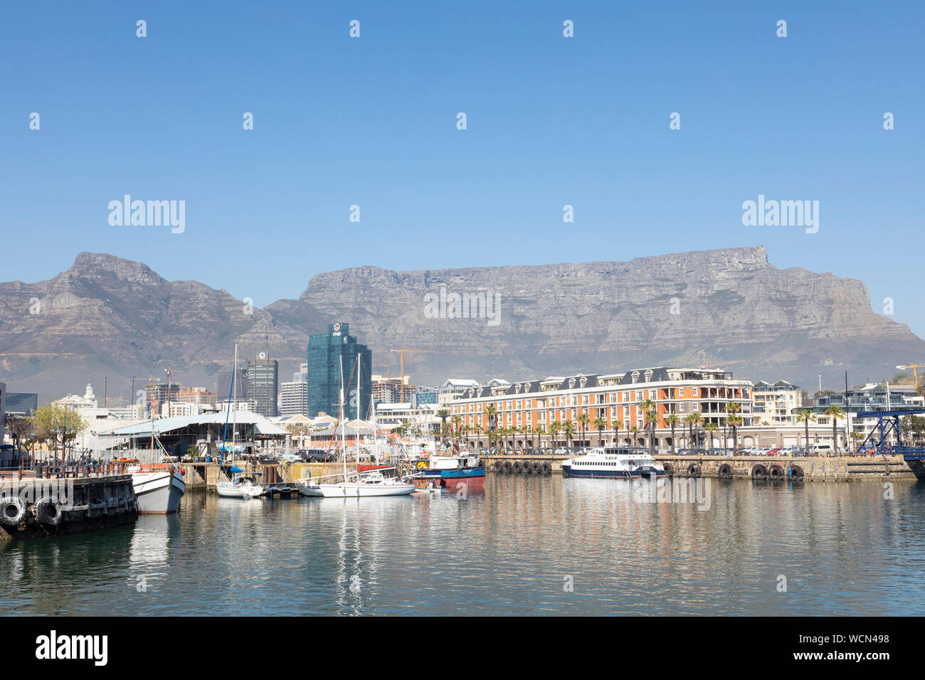 View of Table Mountain and Devils peak from V&A Waterfront, Cape Town South Africa with the Quays and harbour in the foreground Stock Photo