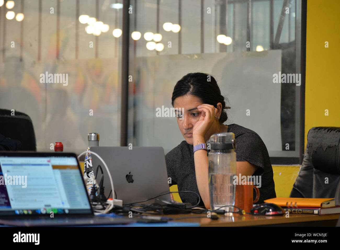 (190828) -- GAZA, Aug. 28, 2019 (Xinhua) -- A woman works inside Gaza Sky Geeks, one of several local innovation hubs in the Gaza Strip, on Aug. 26, 2019. Hundreds of small business ideas come up in the West Bank and Gaza Strip, but only a small number of them flourishes and continues due to the limitations in the supporting eco-system for the start-ups. TO GO WITH "Feature: Palestinian start-ups see limited growth" (Str/Xinhua) Stock Photo