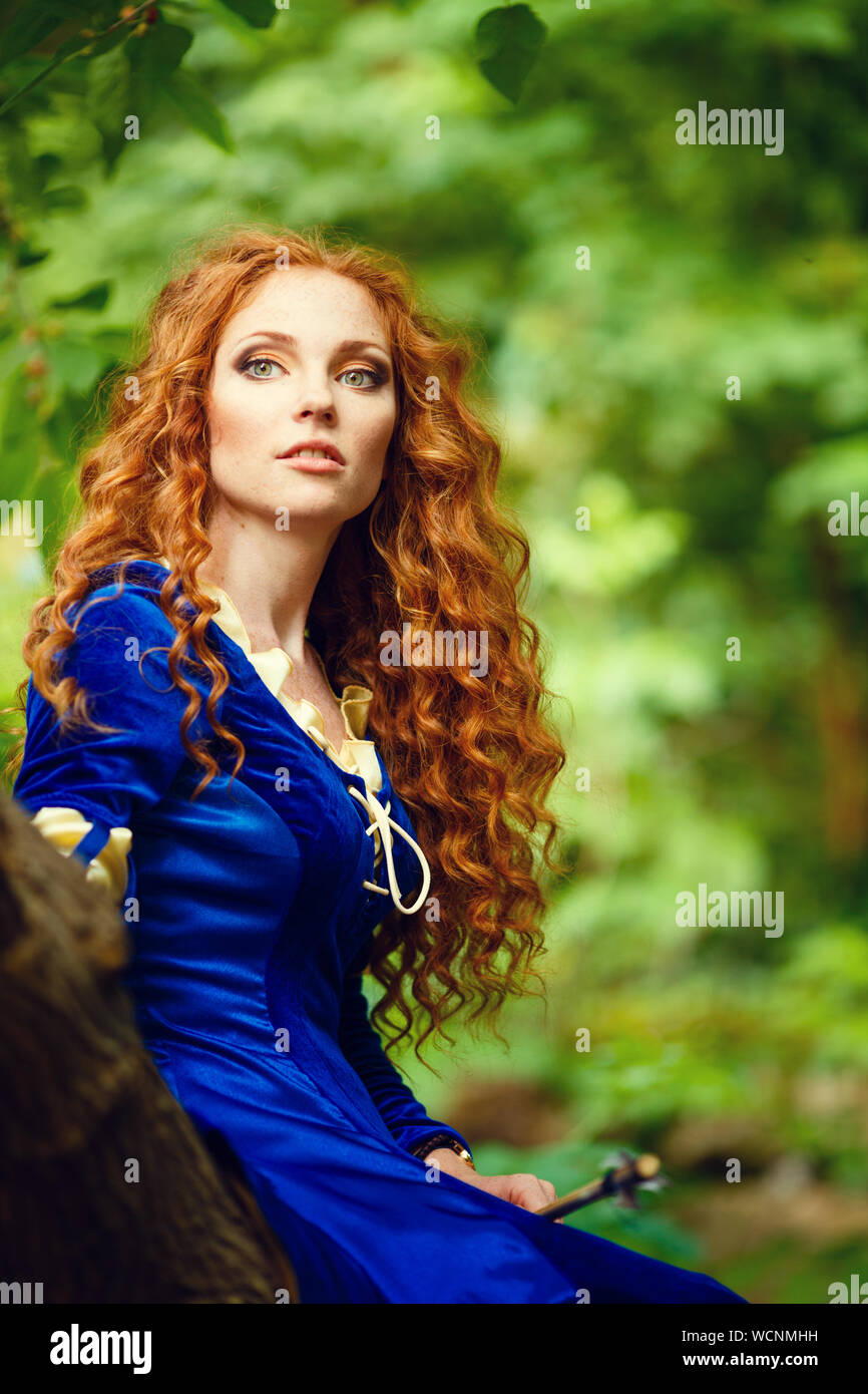Brave. Merida from Brave film. Beautiful red-haired girl in the costume of  the heroine of the animated film Stock Photo - Alamy