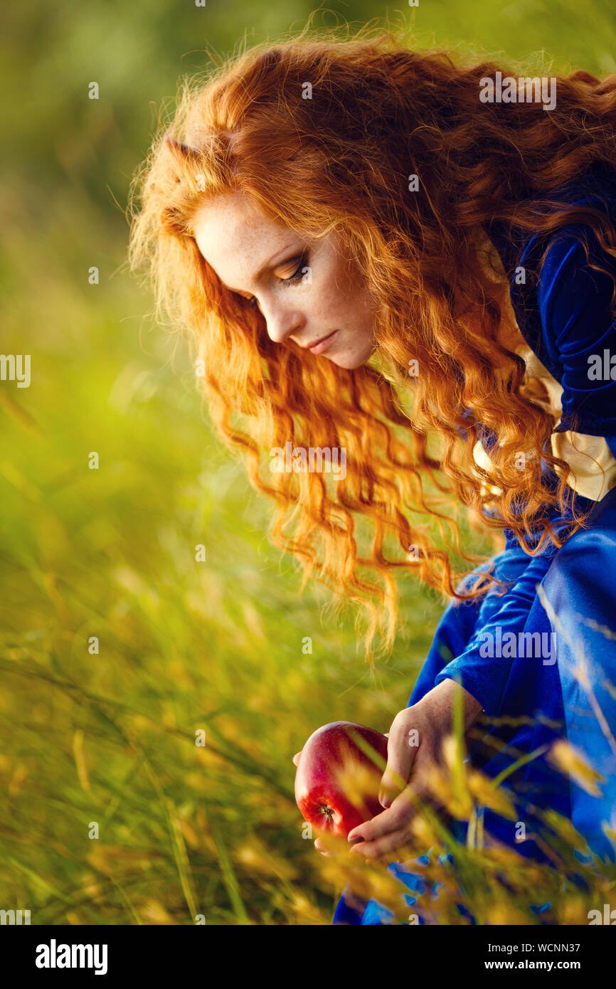 Brave. Merida from Brave film. Beautiful red-haired girl in the costume of  the heroine of the animated film Stock Photo - Alamy
