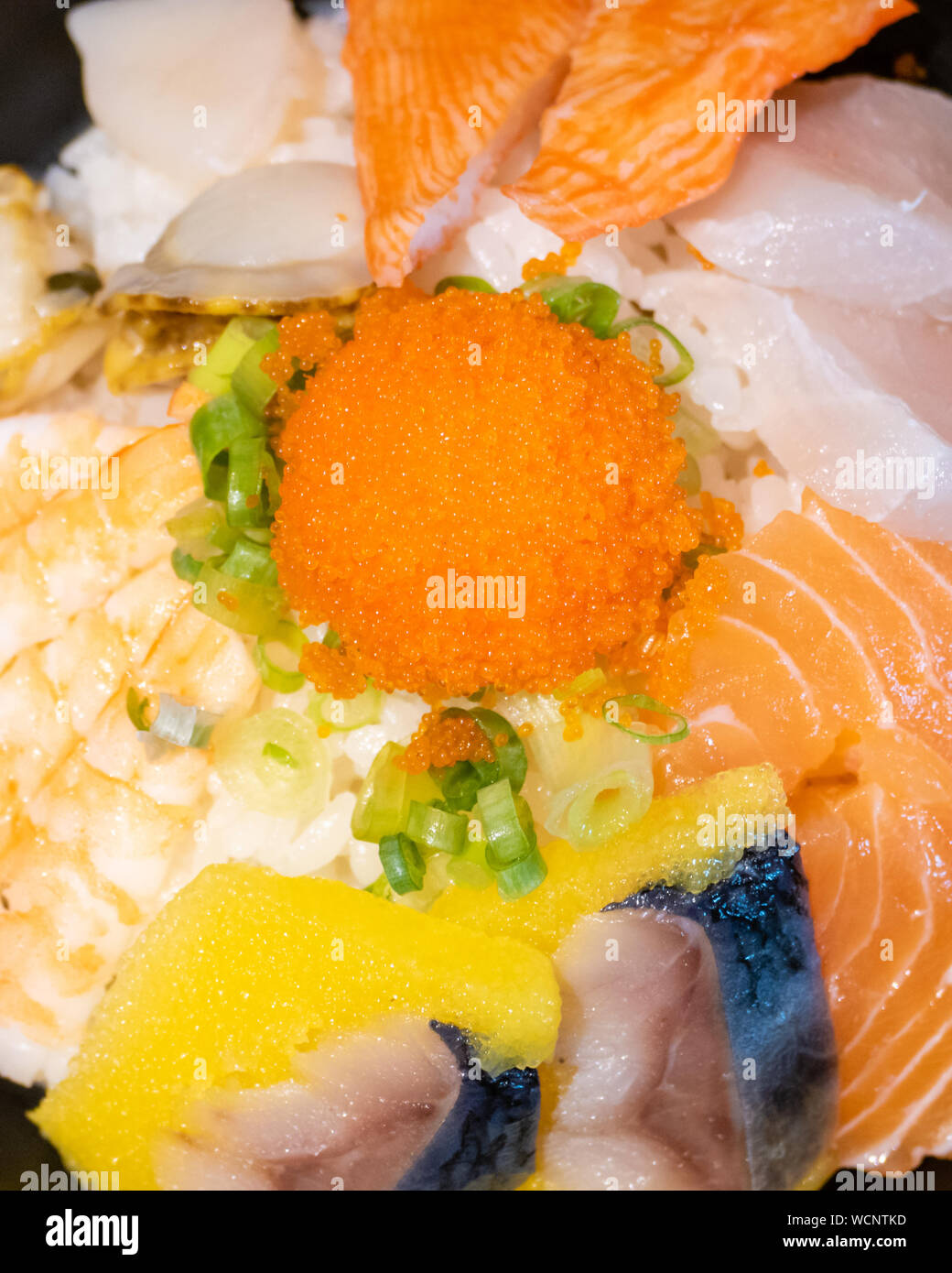 Sashimi in bowl with fish eggs and rice Stock Photo - Alamy