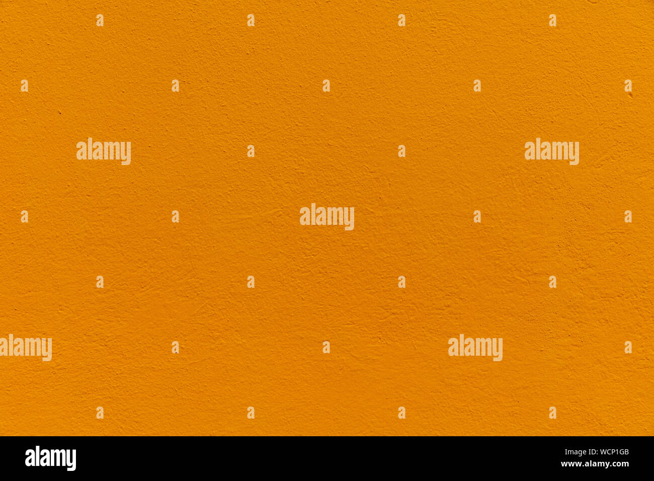 Orange Textured Rendered Wall - Stucco / Fresco effect with small ripples and chips Stock Photo
