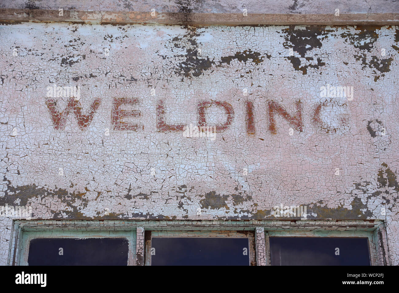 faded paint reading welding Stock Photo