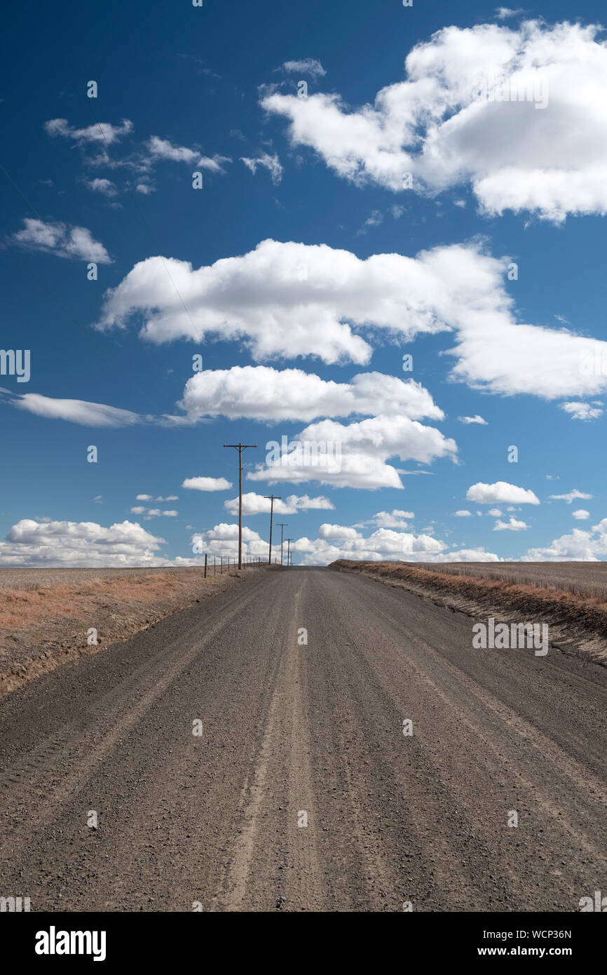 Blue sky with clouds and dirt road hi-res stock photography and images ...