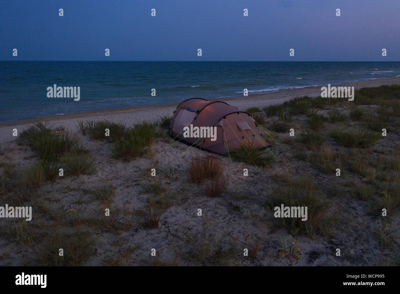 a camping tent on a beach near Black sea at evening Stock Photo