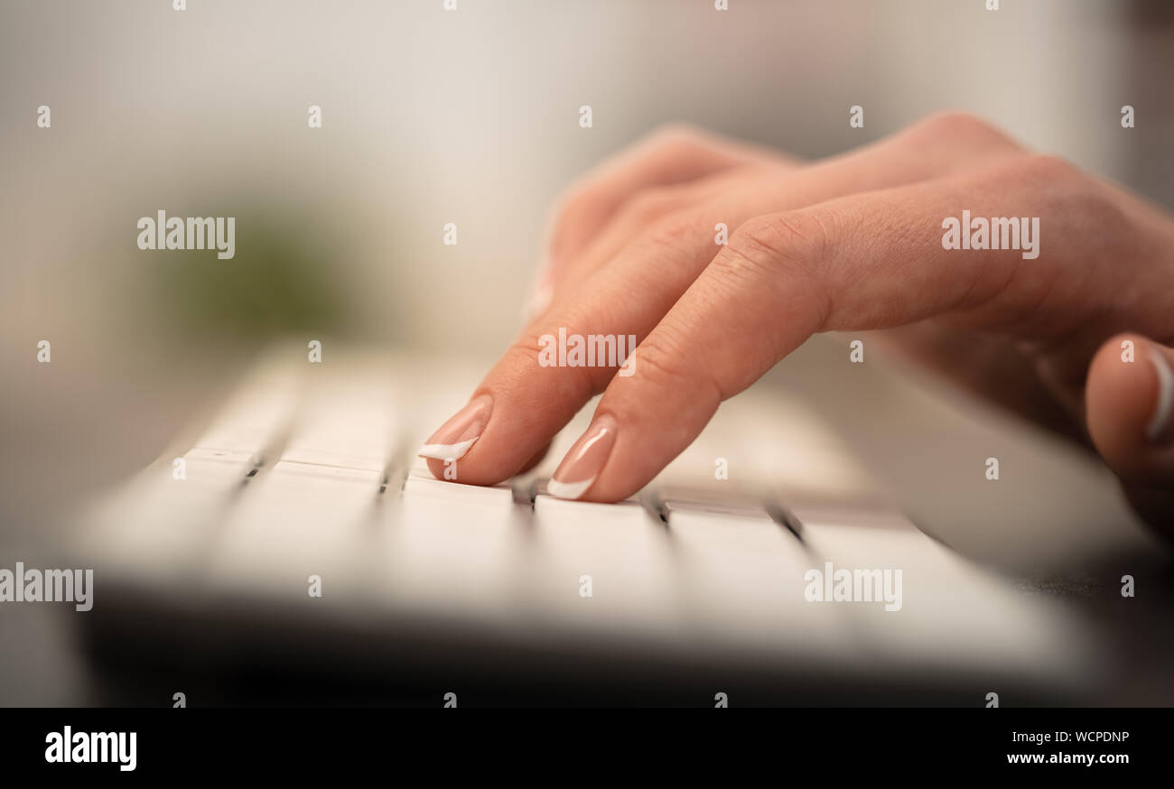 Hand typing on keyboard with office concept Stock Photo - Alamy