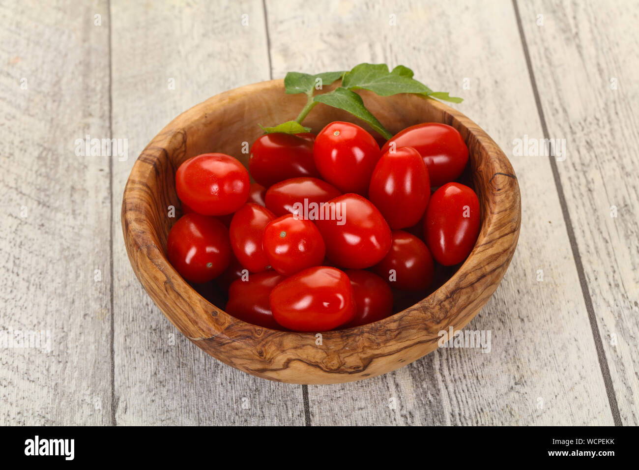 Sweet Red cherry tomatoes in the bowl Stock Photo - Alamy