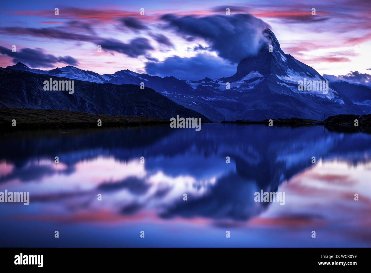 Matterhorn reflected in the Stellisee at sunset, Zermatt, Valais, Switzerland Stock Photo