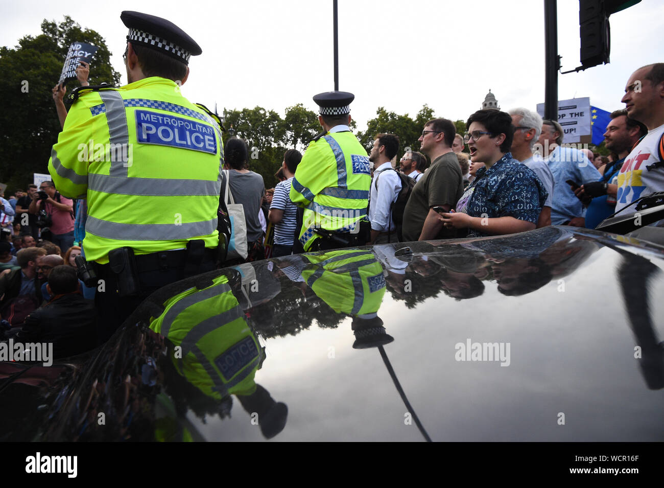 Protesters stop traffic outside the Houses of Parliament, London, as they demonstrate against Prime Minister Boris Johnson temporarily closing down the Commons from the second week of September until October 14 when there will be a Queen's Speech to open a new session of Parliament. Stock Photo