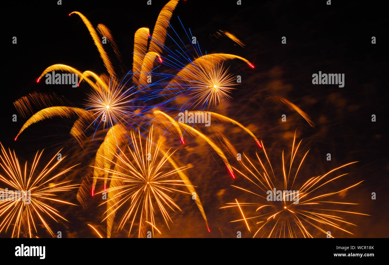 Colorful fireworks in night sky background Stock Photo - Alamy