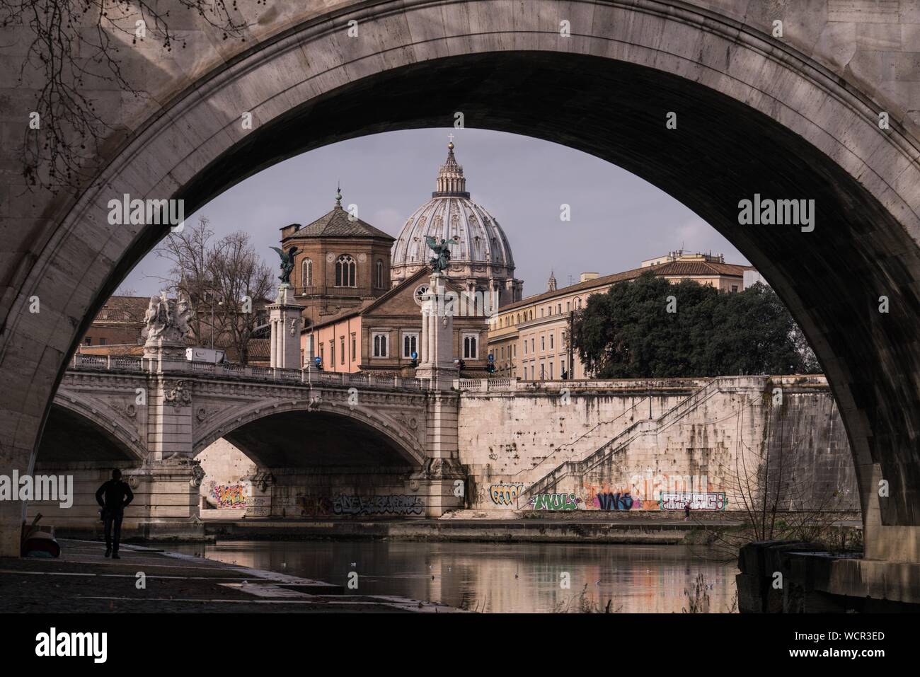 Saint Peter Basilica Seen From Arch Bridge In City Stock Photo