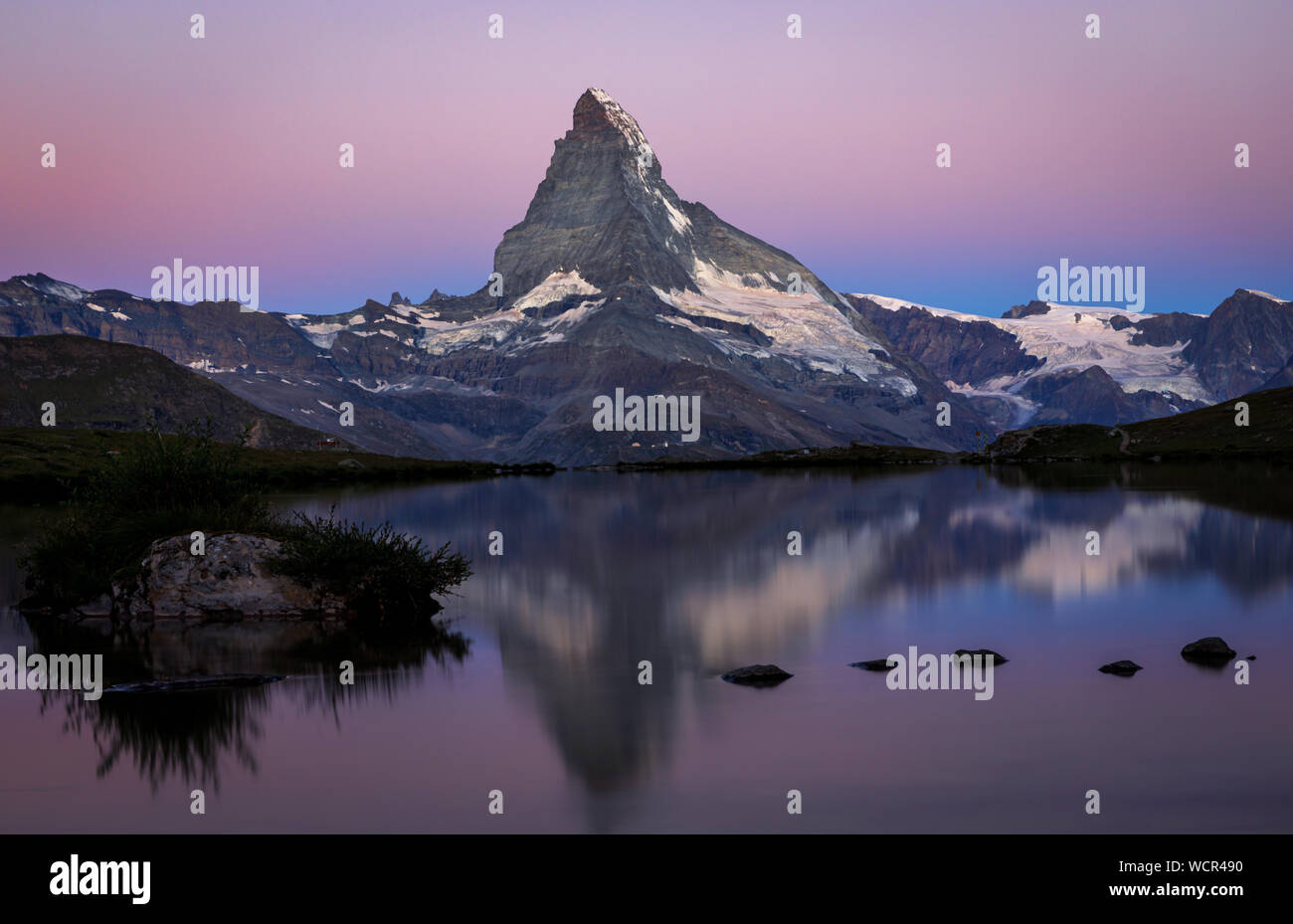 Matterhorn reflected in the Stellisee at sunrise, Zermatt, Valais ...