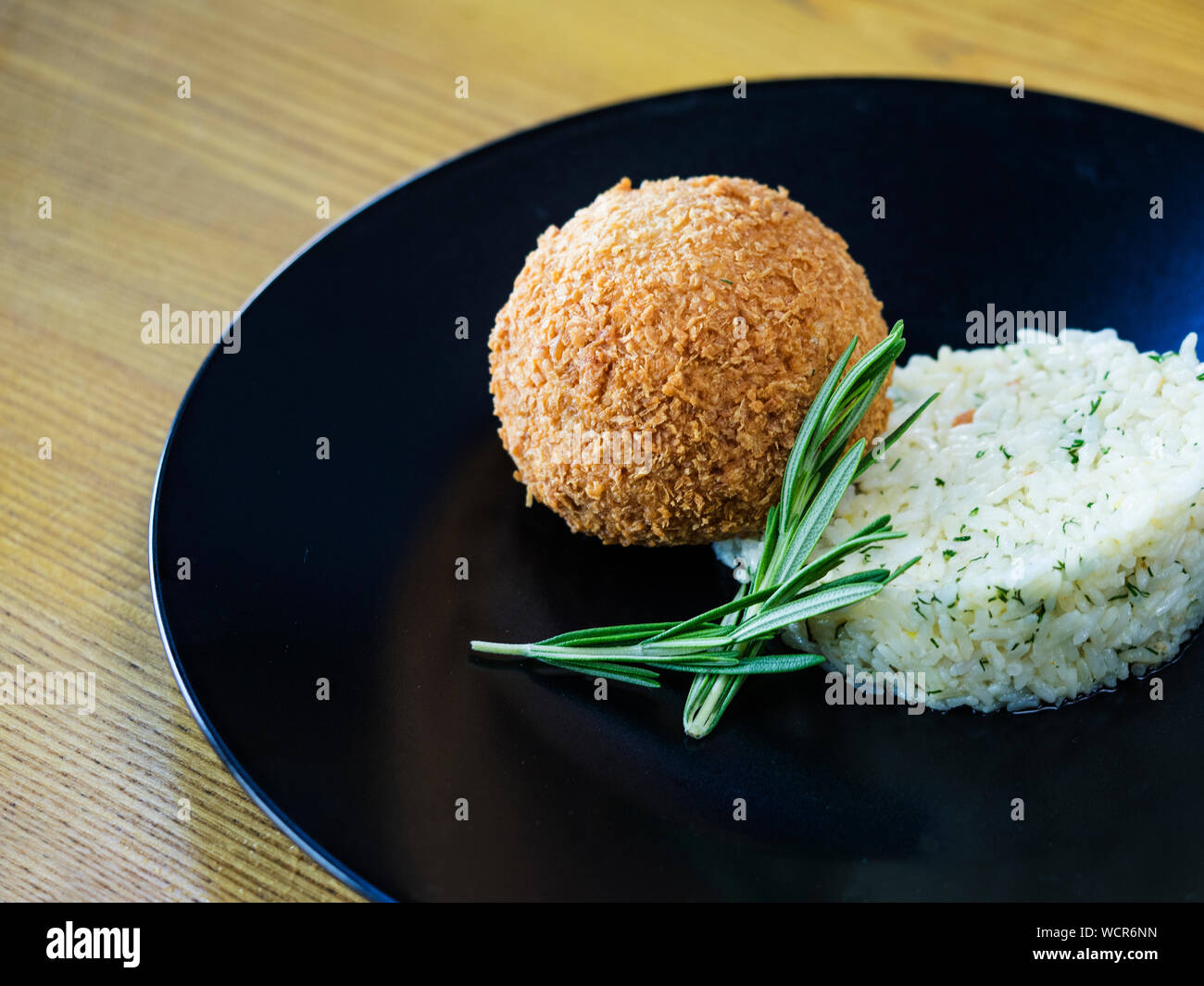 Close-up Of Stuffed Cutlet With Rice Served In Plate Stock Photo