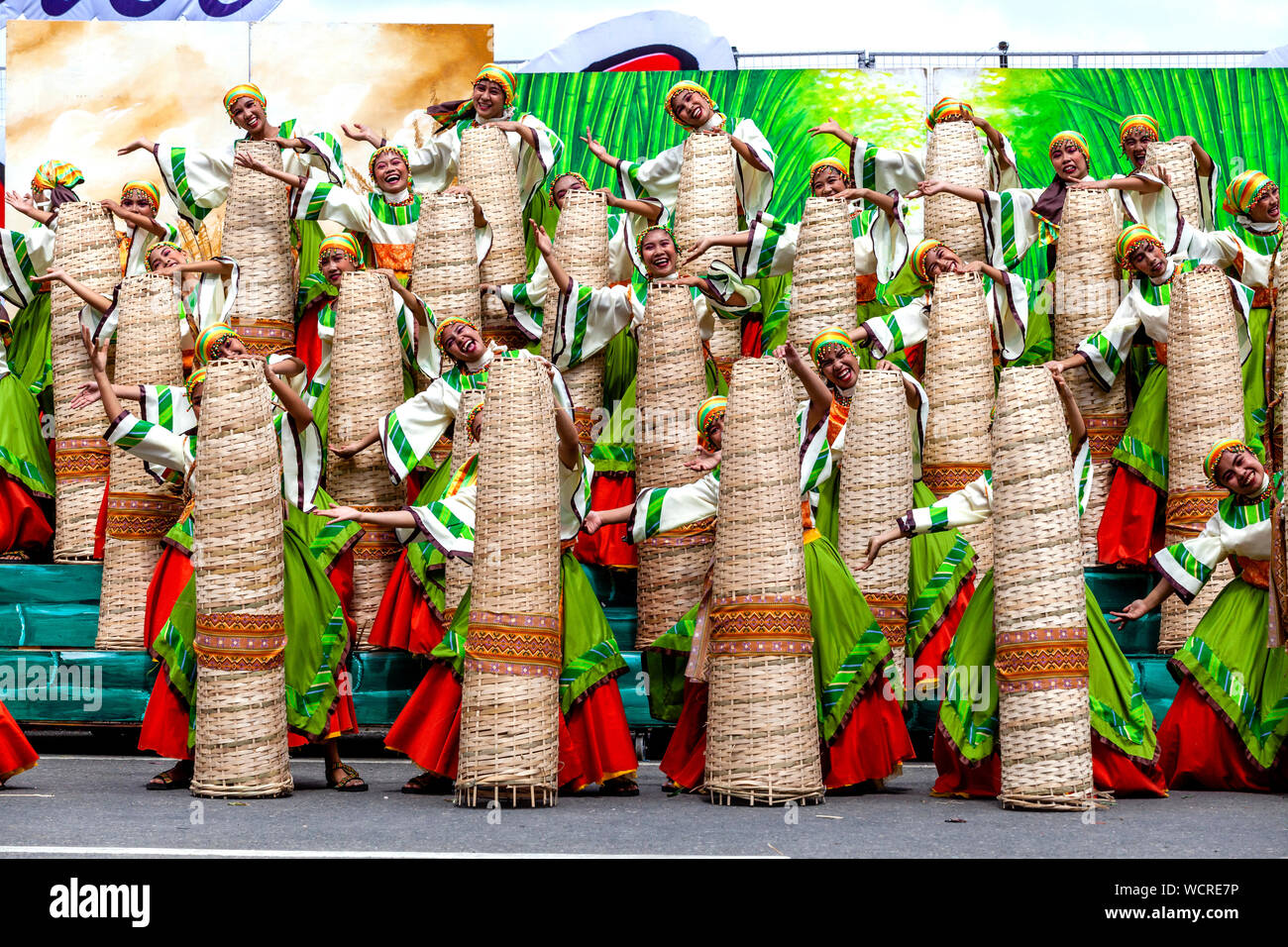 Young Filipino Women Dancing In The Kasadyahan Contest, Dinagyang Festival, Iloilo City, Panay Island, The Philippines. Stock Photo