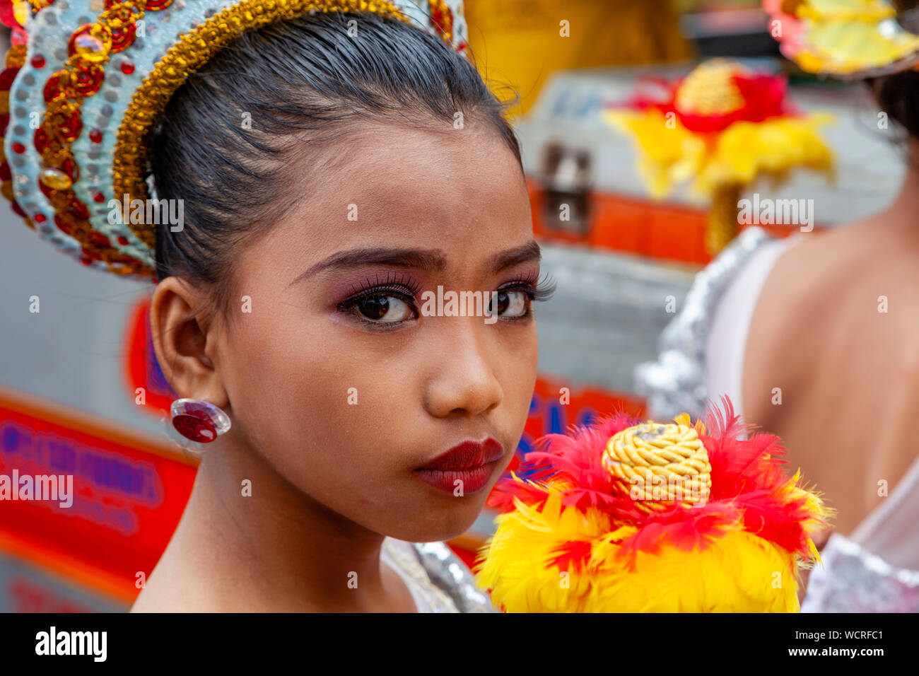 An Elementary Schoolgirl Waits To Perform In The Tambor Trumpa Martsa Musika (Drum & Bugle) Contest, Dinagyang Festival, Iloilo City, The Philippines. Stock Photo