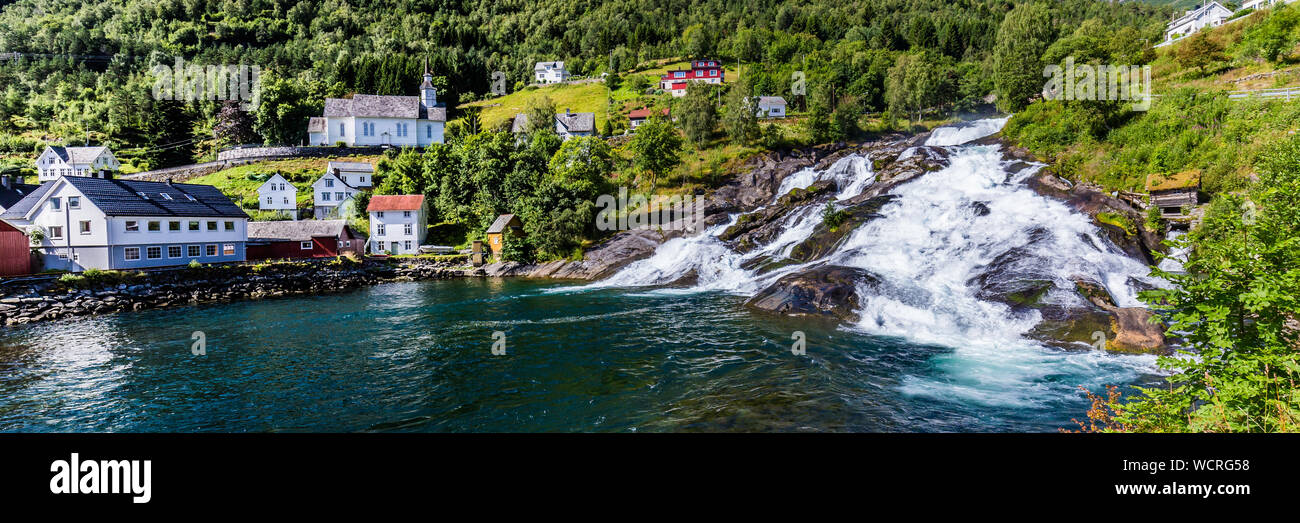 Panorama of small village Hellesylt with Hellesyltfossen waterfall in ...