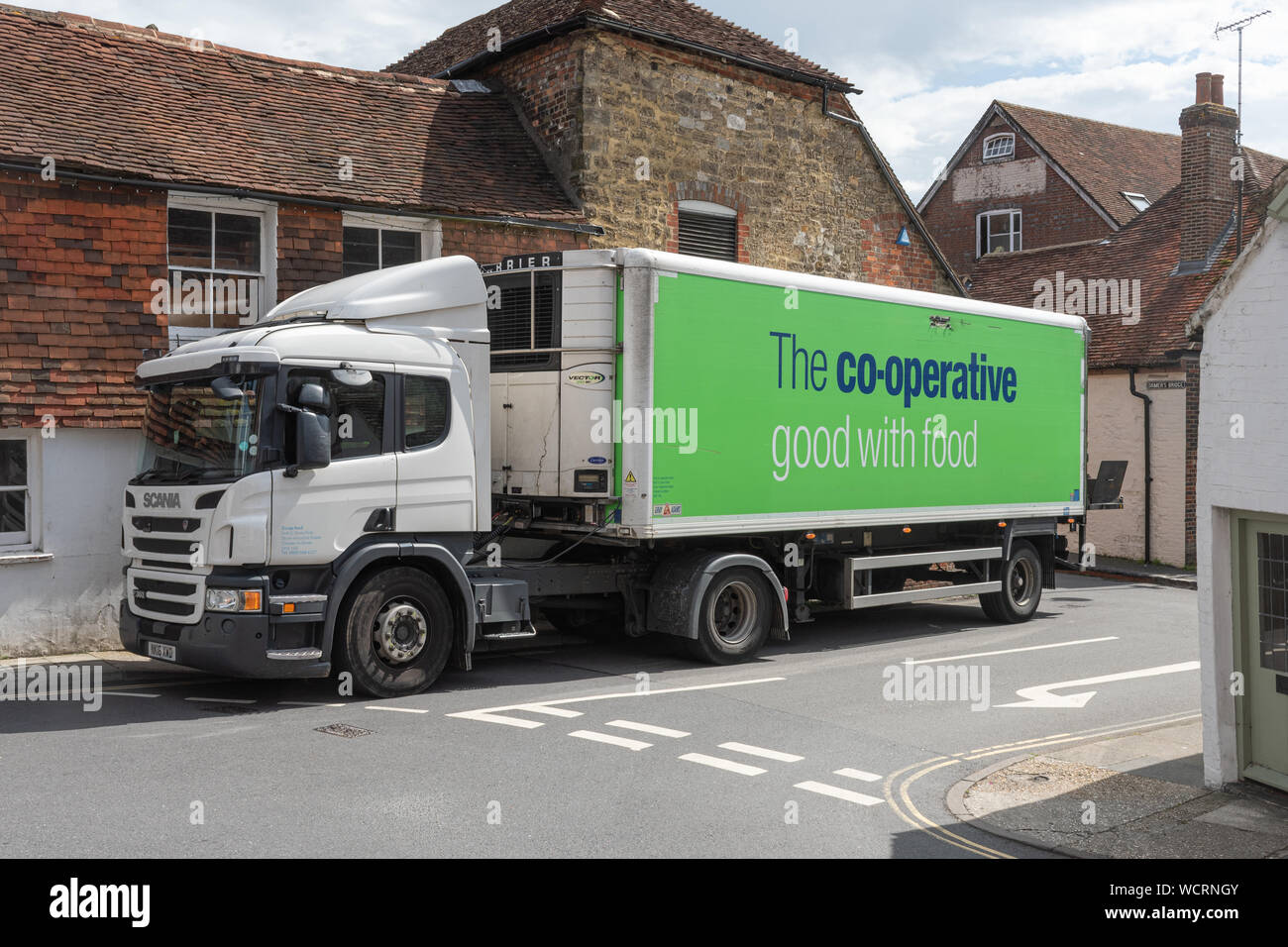 A coop (cooperative) food delivery lorry truck van delivering goods