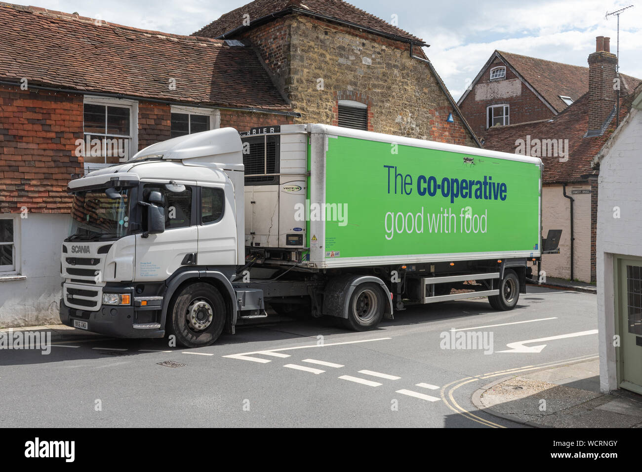 A co-op (co-operative) food delivery lorry truck van delivering goods to a shop, UK Stock Photo